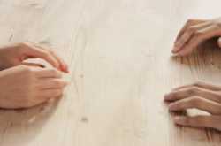 (Far) across the table