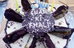 Chocolate cake with peanut butter frosting topped with caramelised chocolate cake slices