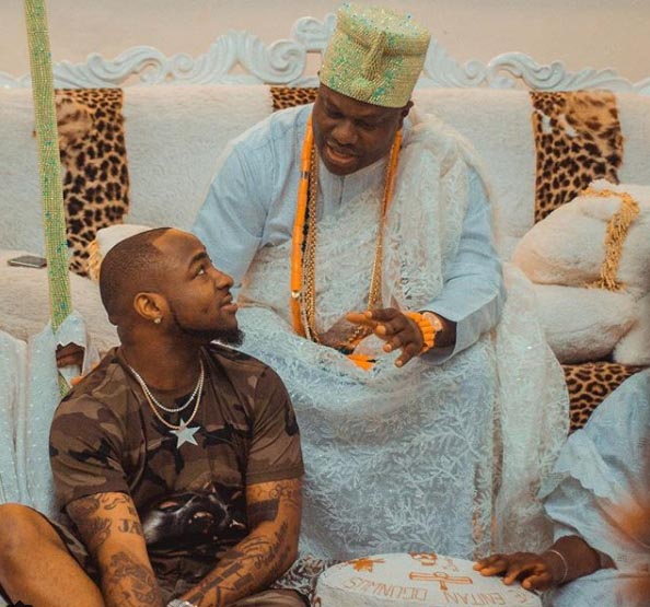 Davido Lies Flat On The Ground Before Ooni Of Ife.
