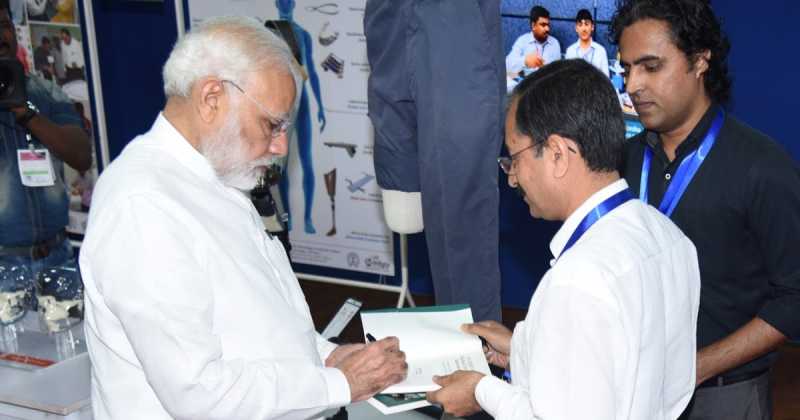 NEW RELEASE: PM MODI AUTOGRAPHS MEDICAL DEVICE INNOVATION BOOK    