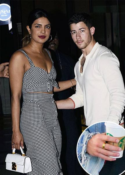 Nick Jonas And Priyanka Chopra Spotted With Coordinated Gold Rings