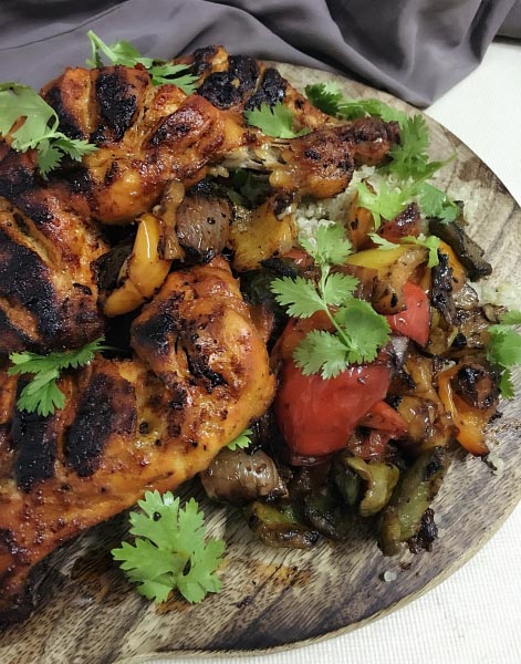 Spicy Harissa Chicken With Roasted Peppers Served With Quinoa Salad.