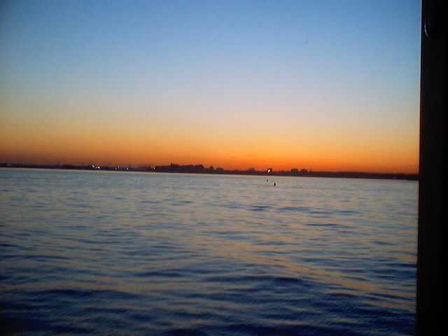 Sunset Over Statue Of Liberty