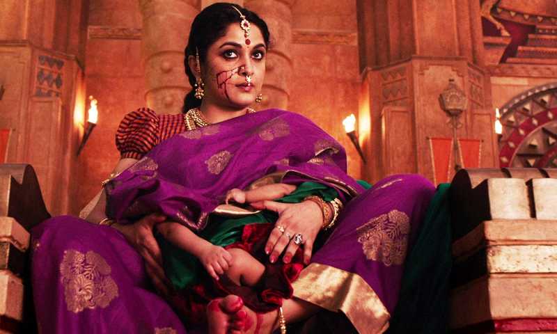 THE FABULOUS QUEEN FEEDING HER  TWIN BABIES IN THE MAGNIFICENT COURT OF BAHUBALI 