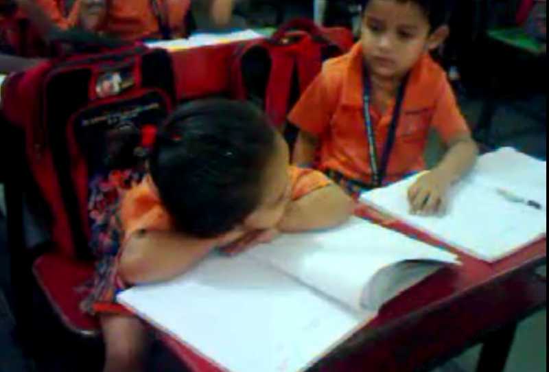 Teacher And Classmate Trying To Wake Up A Sleeping Kid In Class