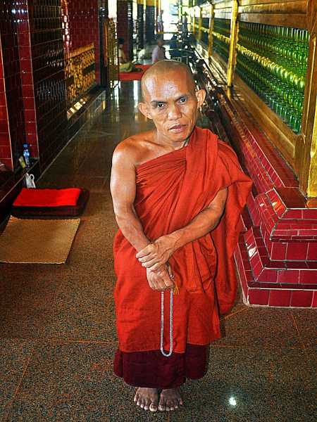 The Dwarfed Monk At Mandalay